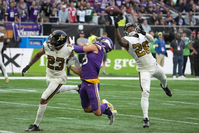 Oct 2, 2022; New Orleans Saints defensive backs P.J. Williams (26) and Marshon Lattimore (23) defend against Minnesota Vikings receiver Adam Thielen (19). Mandatory Credit: Kirby Lee-USA TODAY Sports